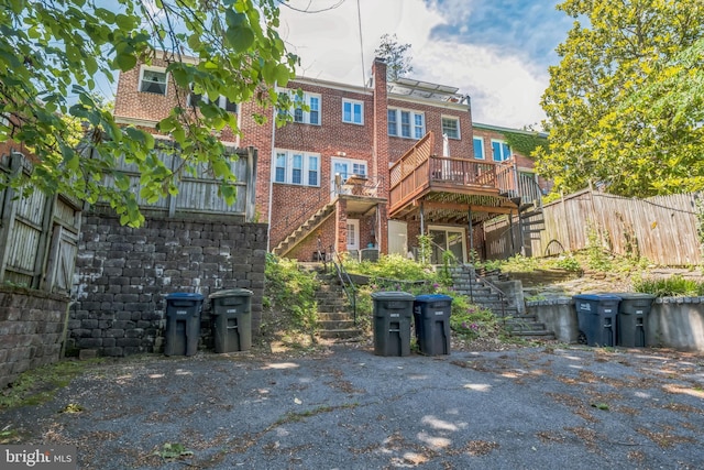 2217 Observatory Pl NW, Washington, DC 20007 - back of house featuring stairway, brick siding, and a deck