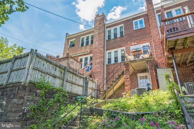 2217 Observatory Pl NW, Washington, DC 20007 - back of property featuring brick siding and central AC unit
