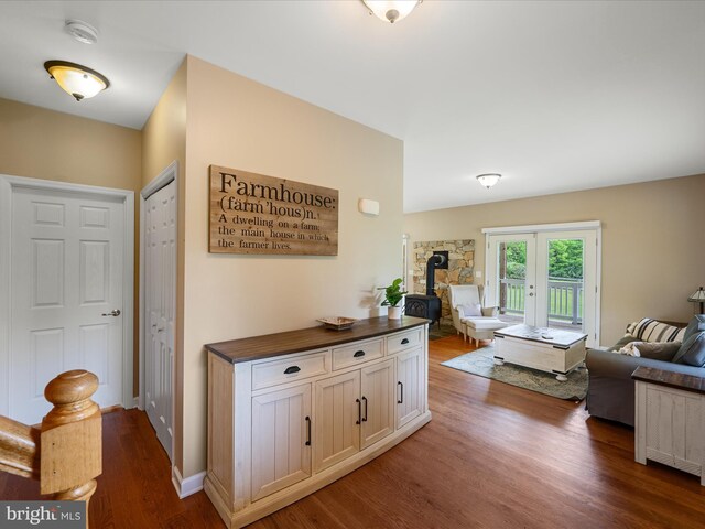 hall with dark wood finished floors and french doors