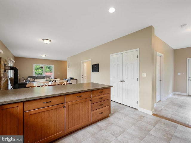 kitchen featuring brown cabinets and baseboards