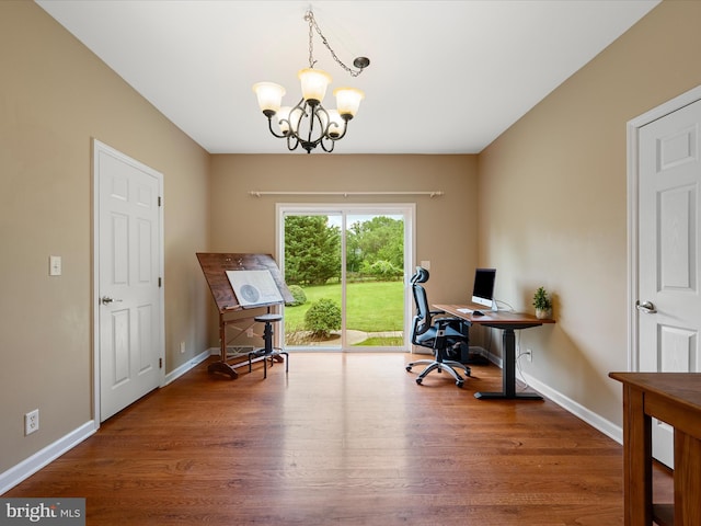 office featuring wood finished floors, a chandelier, and baseboards