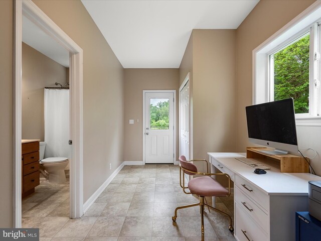 office area featuring healthy amount of natural light and baseboards