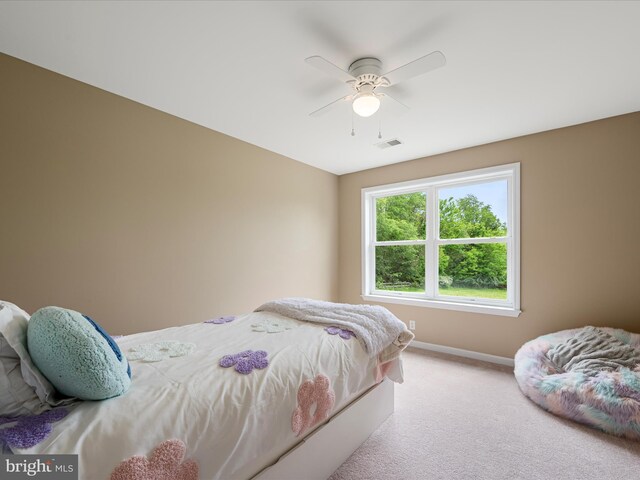bedroom with baseboards, carpet, and a ceiling fan