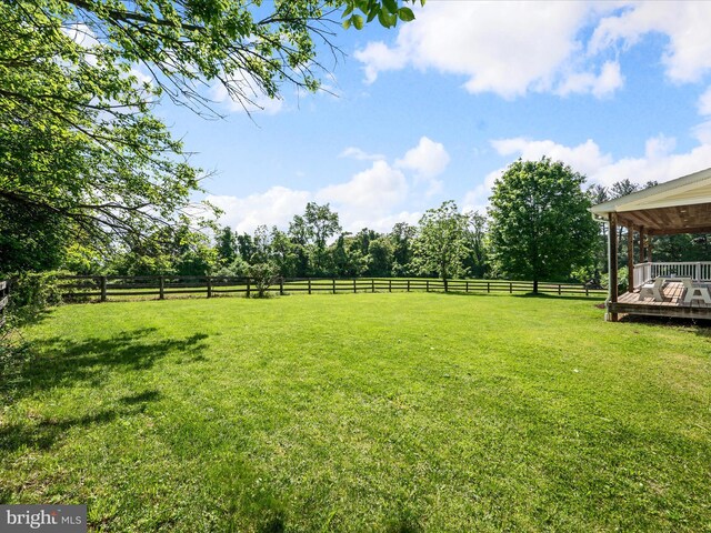 view of yard featuring a wooden deck