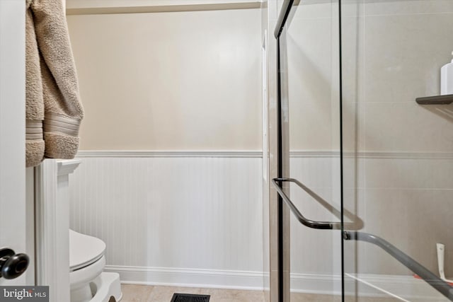 2000 Eton Ct Unit 2000, West Chester, PA 19382 - bathroom with a stall shower, toilet, and wainscoting