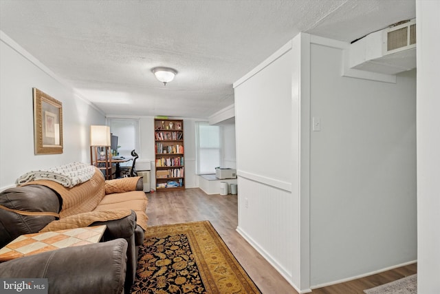2000 Eton Ct Unit 2000, West Chester, PA 19382 - living room with light wood-style floors, a textured ceiling, and built in shelves