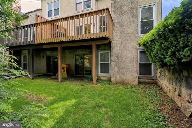 2000 Eton Ct Unit 2000, West Chester, PA 19382 - rear view of house featuring a lawn, a deck, and stucco siding