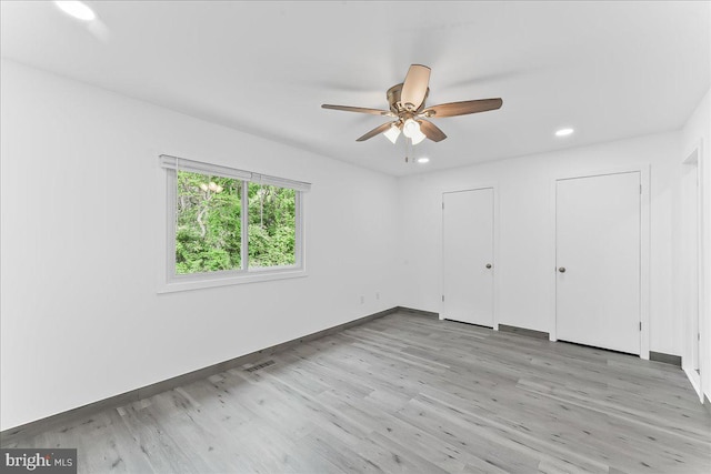 unfurnished bedroom featuring light wood-type flooring, baseboards, recessed lighting, and ceiling fan
