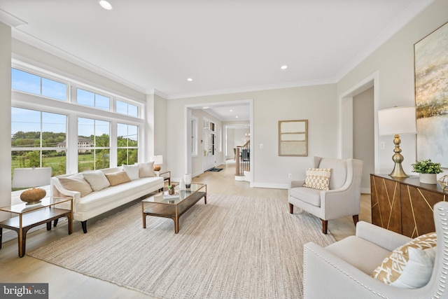 living room featuring ornamental molding, light wood-style flooring, recessed lighting, and baseboards