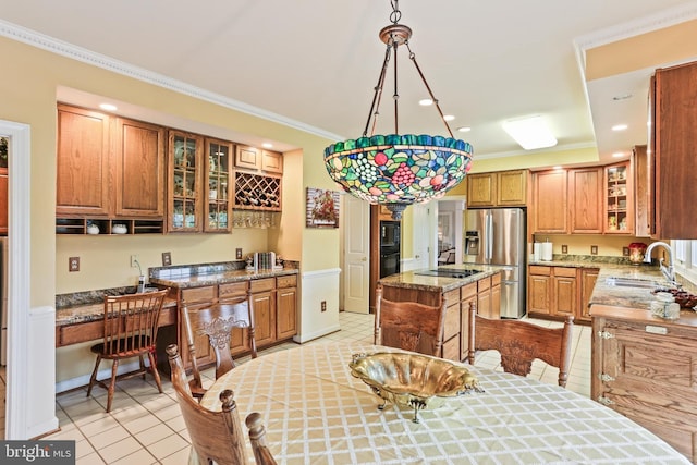 7103 Brookshire Ln, Clarksville, MD 21029 - kitchen with black appliances, a sink, a center island, light tile patterned floors, and ornamental molding