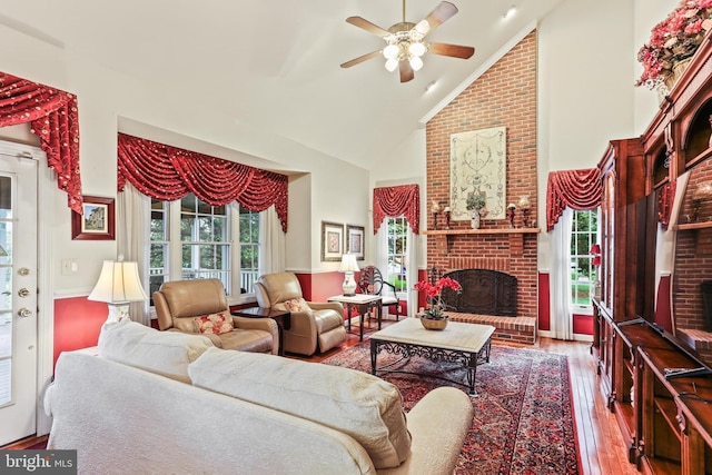 7103 Brookshire Ln, Clarksville, MD 21029 - living room featuring high vaulted ceiling, wood finished floors, a brick fireplace, and a ceiling fan