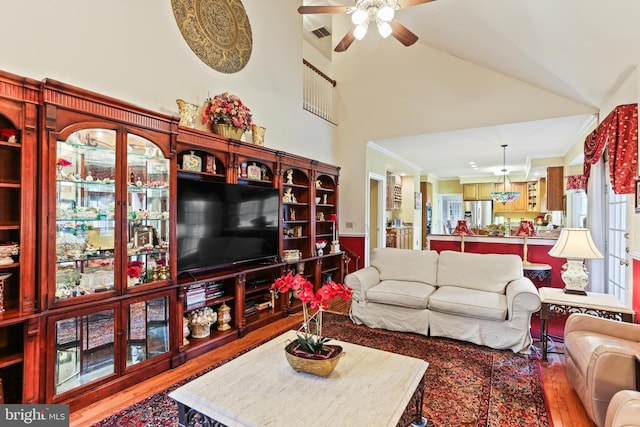7103 Brookshire Ln, Clarksville, MD 21029 - living area with a ceiling fan, light wood-type flooring, high vaulted ceiling, and ornamental molding