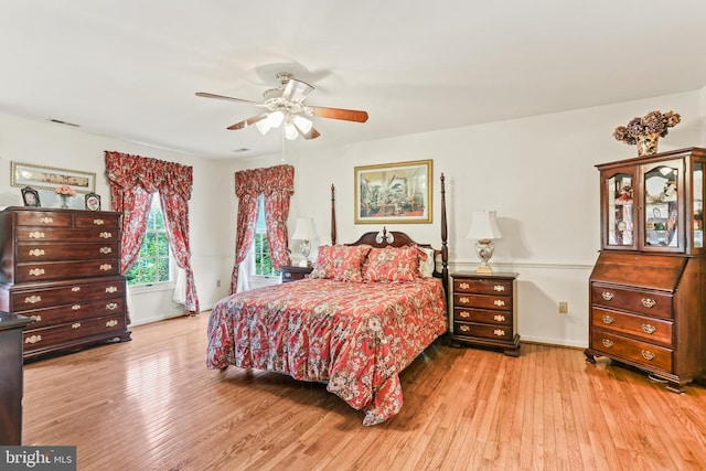 7103 Brookshire Ln, Clarksville, MD 21029 - bedroom with wood-type flooring, a ceiling fan, and baseboards