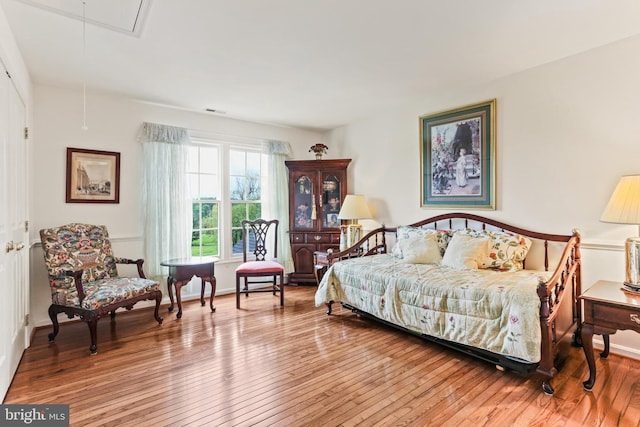 7103 Brookshire Ln, Clarksville, MD 21029 - bedroom featuring attic access, hardwood / wood-style flooring, and baseboards
