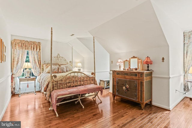 7103 Brookshire Ln, Clarksville, MD 21029 - bedroom with wood-type flooring, vaulted ceiling, and baseboards