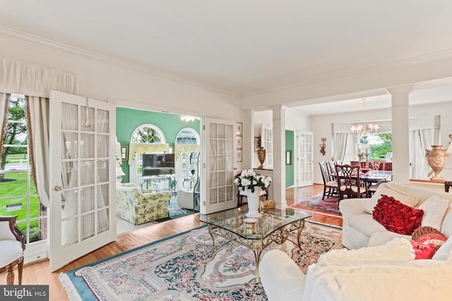 7103 Brookshire Ln, Clarksville, MD 21029 - living room featuring ornate columns, french doors, ornamental molding, wood finished floors, and plenty of natural light