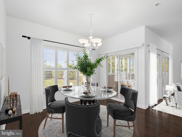18880 Forgotten Harbor Ct Unit 402F, Rehoboth Beach, DE 19971 - dining area with a chandelier, wood finished floors, and baseboards