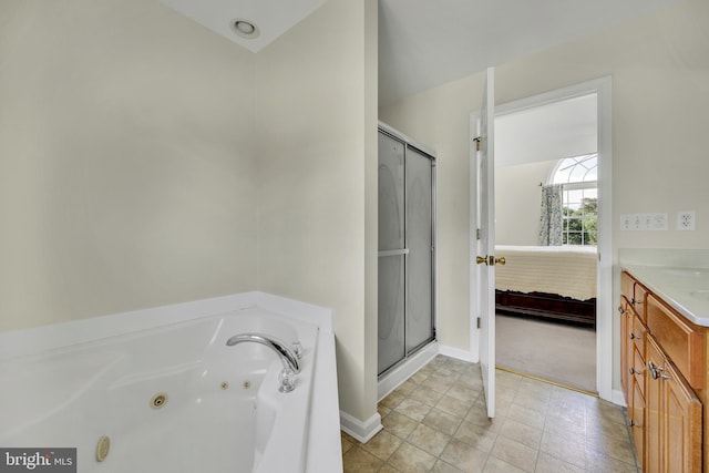 25977 Kildee Run, Mardela Springs, MD 21837 - bathroom with ensuite bathroom, vanity, a stall shower, a jetted tub, and baseboards
