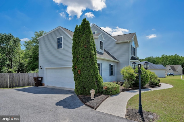 25977 Kildee Run, Mardela Springs, MD 21837 - view of home's exterior with asphalt driveway, a garage, and a shingled roof