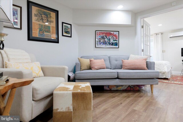 744 7th St SE, Washington, DC 20003 - living room featuring a wall mounted air conditioner, wood finished floors, and recessed lighting