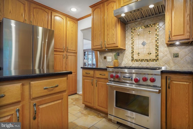 7750 Carrleigh Pkwy, Springfield, VA 22152 - kitchen with stainless steel appliances, under cabinet range hood, decorative backsplash, brown cabinetry, and recessed lighting