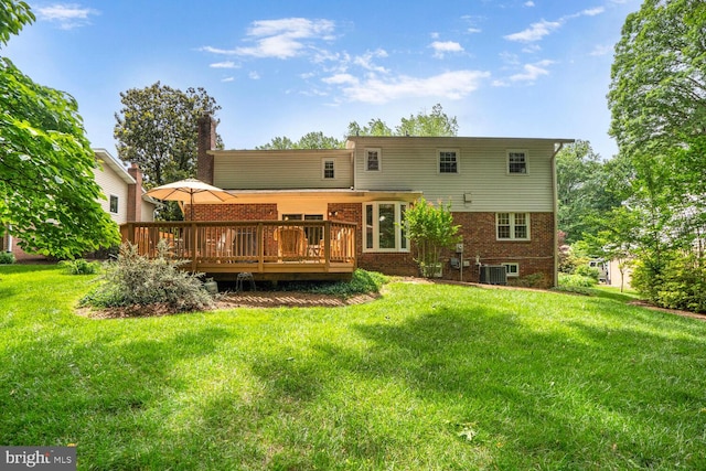 7750 Carrleigh Pkwy, Springfield, VA 22152 - rear view of house with a wooden deck, a yard, brick siding, and cooling unit