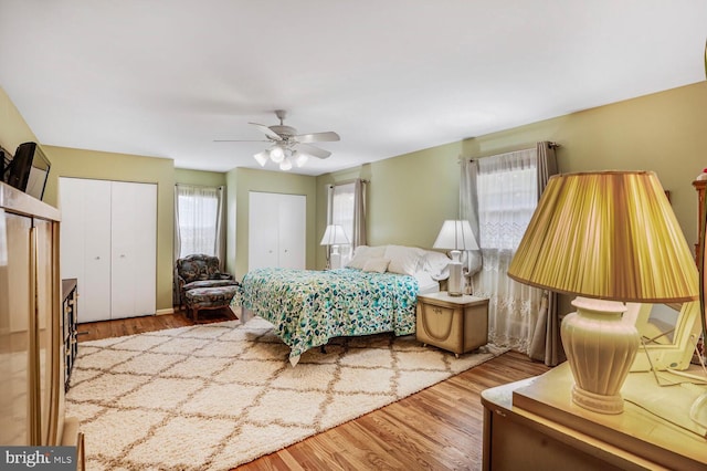 7750 Carrleigh Pkwy, Springfield, VA 22152 - bedroom with wood finished floors, two closets, and ceiling fan