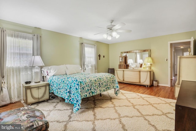 7750 Carrleigh Pkwy, Springfield, VA 22152 - bedroom with wood finished floors, ceiling fan, and baseboards