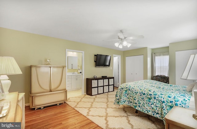 7750 Carrleigh Pkwy, Springfield, VA 22152 - bedroom featuring wood finished floors, baseboards, ensuite bath, and ceiling fan