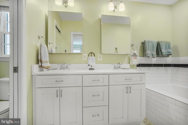 7750 Carrleigh Pkwy, Springfield, VA 22152 - full bathroom featuring toilet, double vanity, and a garden tub