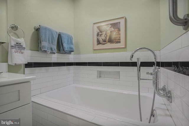 7750 Carrleigh Pkwy, Springfield, VA 22152 - bathroom featuring tiled bath and vanity