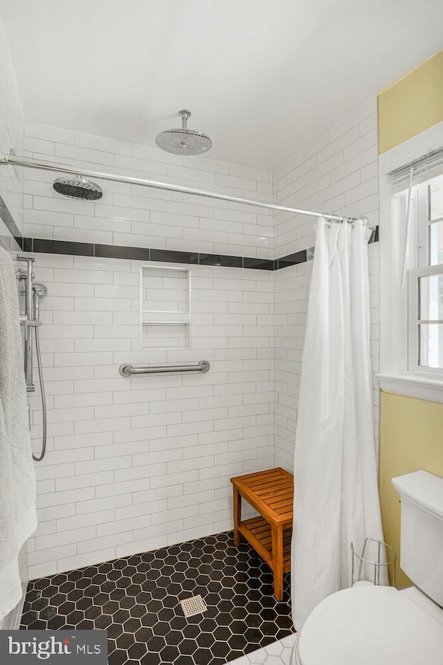7750 Carrleigh Pkwy, Springfield, VA 22152 - full bath featuring a stall shower and toilet