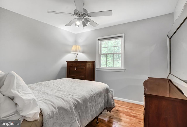 7750 Carrleigh Pkwy, Springfield, VA 22152 - bedroom featuring wood finished floors, baseboards, and a ceiling fan