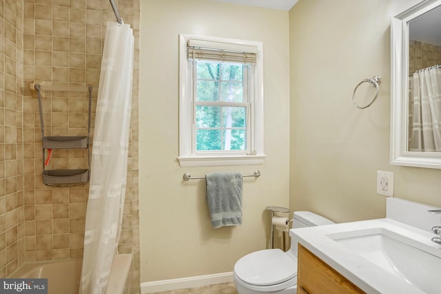 7750 Carrleigh Pkwy, Springfield, VA 22152 - bathroom with toilet, vanity, shower / tub combo with curtain, and baseboards