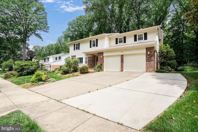 7750 Carrleigh Pkwy, Springfield, VA 22152 - traditional home with brick siding, concrete driveway, an attached garage, and view of wooded area
