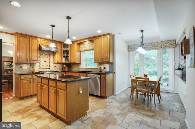 7750 Carrleigh Pkwy, Springfield, VA 22152 - kitchen featuring dishwasher, a sink, dark countertops, under cabinet range hood, and backsplash