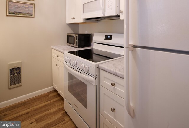 774 W Aaron Dr, State College, PA 16803 - kitchen featuring white appliances, light wood-style flooring, white cabinets, baseboards, and light countertops