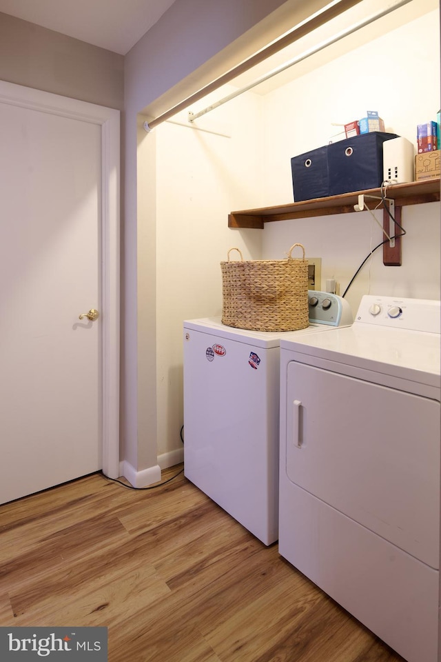 774 W Aaron Dr, State College, PA 16803 - laundry area with washer and dryer, light wood-type flooring, and baseboards