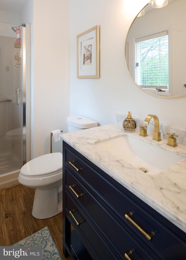 774 W Aaron Dr, State College, PA 16803 - bathroom featuring vanity, a shower stall, toilet, and wood finished floors