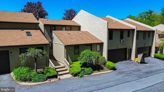 774 W Aaron Dr, State College, PA 16803 - townhome / multi-family property with an attached garage, roof with shingles, and concrete driveway