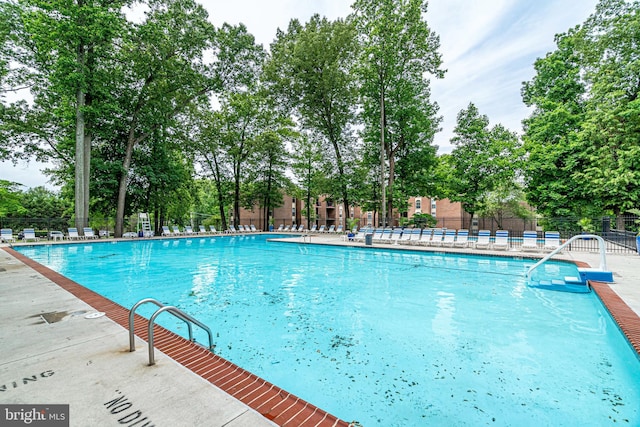 3320 Woodburn Village Dr Unit 32, Annandale, VA 22003 - community pool with fence and view of wooded area