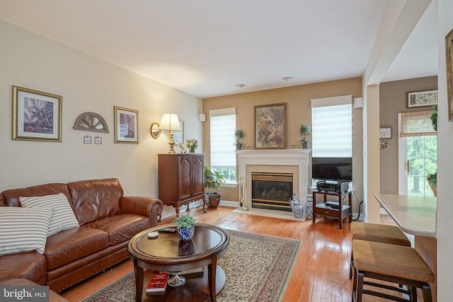 87 Chapel Hill Rd, Mount Laurel, NJ 08054 - living room with light wood-style flooring and a glass covered fireplace