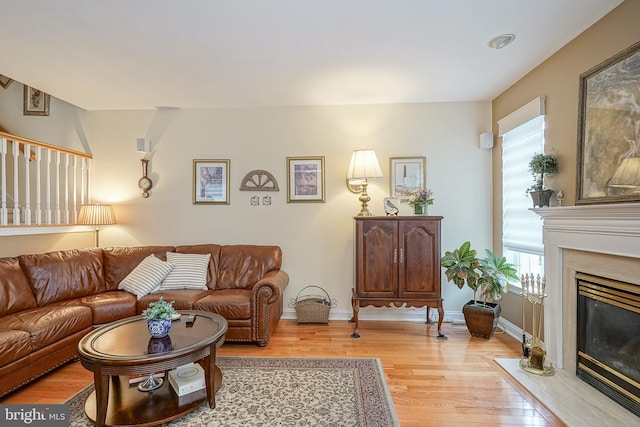 87 Chapel Hill Rd, Mount Laurel, NJ 08054 - living room featuring light wood-style flooring, a fireplace, and baseboards
