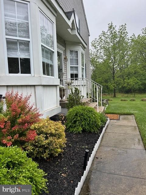 view of side of property with a lawn