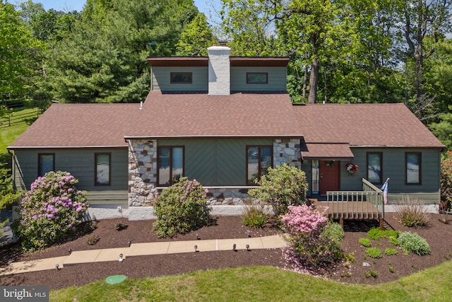 4 Fox Ridge Rd, Glenmoore, PA 19343 - mid-century modern home featuring a chimney, roof with shingles, stone siding, and a wooden deck