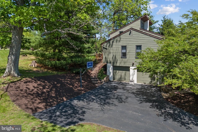 4 Fox Ridge Rd, Glenmoore, PA 19343 - view of side of home with driveway, an attached garage, and stairs