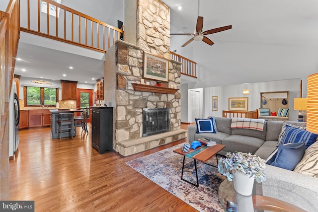 4 Fox Ridge Rd, Glenmoore, PA 19343 - living area featuring high vaulted ceiling, ceiling fan, a fireplace, light wood-type flooring, and recessed lighting