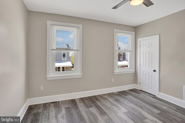 6706 Marsden St, Philadelphia, PA 19135 - unfurnished room featuring healthy amount of natural light, wood finished floors, ceiling fan, and baseboards