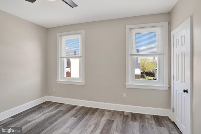 6706 Marsden St, Philadelphia, PA 19135 - empty room featuring plenty of natural light, wood finished floors, and baseboards