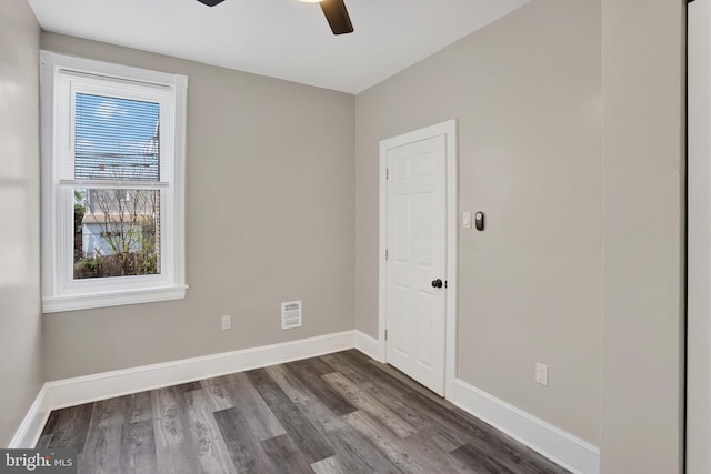 6706 Marsden St, Philadelphia, PA 19135 - empty room with a ceiling fan, dark wood-type flooring, and baseboards